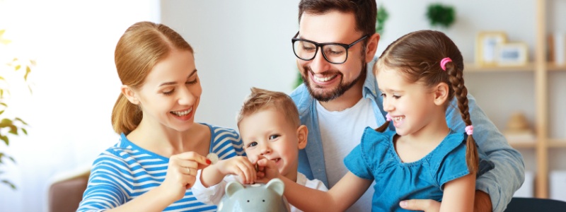 family teaching kids to save money