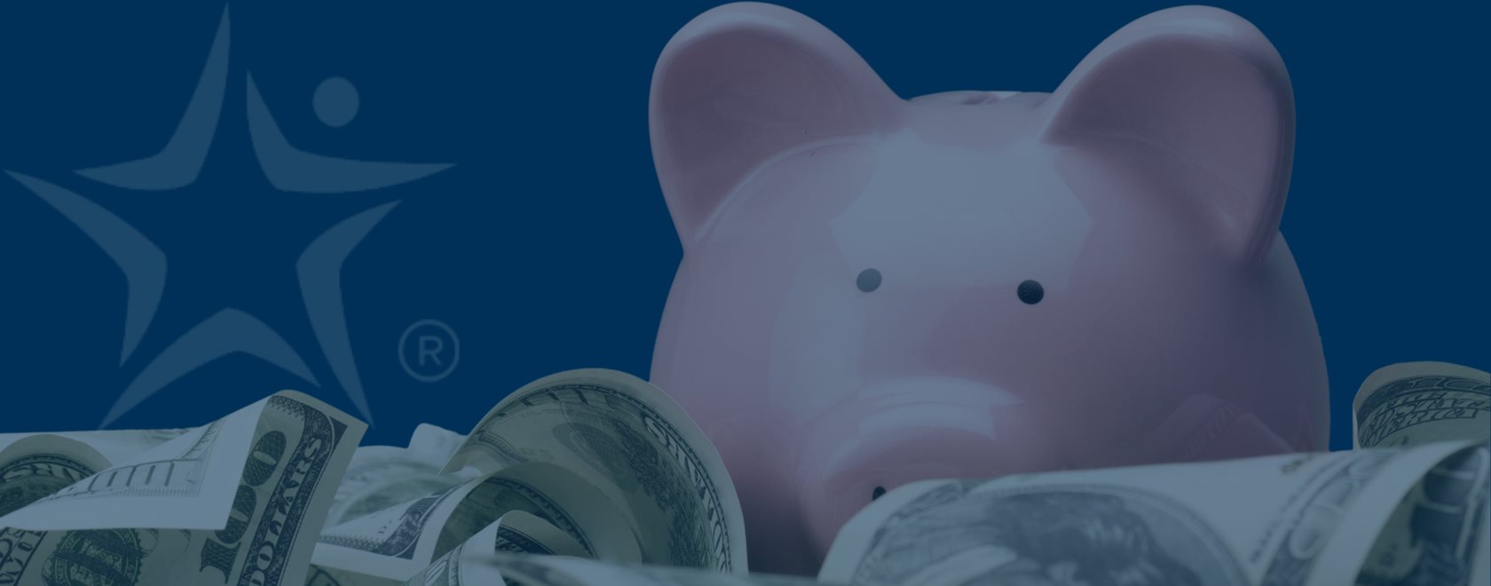 Image of piggy bank surrounded by large money bills